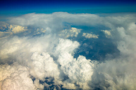 Blue sky background with tiny cloudsの写真素材