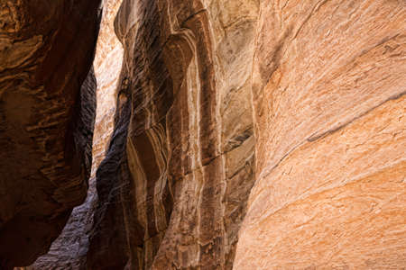 The Siq, the narrow slot-canyon that serves as the entrance passage to the hidden city of Petra, Jordan,の写真素材