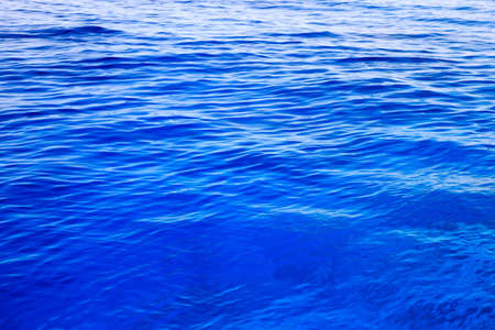 water with sun reflectionsの写真素材