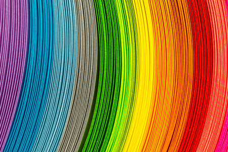 Paper strips in rainbow colors as a colorful backdropの写真素材