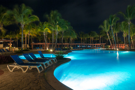 swimming pool in night illuminationの写真素材