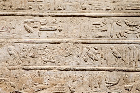 old egypt hieroglyphs carved on the stone