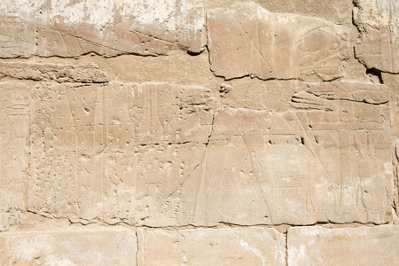 old egypt hieroglyphs carved on the stone