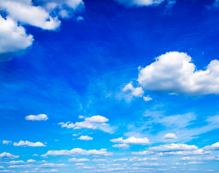 Blue sky background with tiny cloudsの写真素材