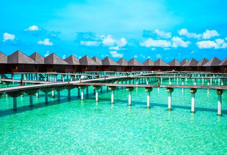 tropical beach in Maldives with few palm trees and blue lagoonのeditorial素材