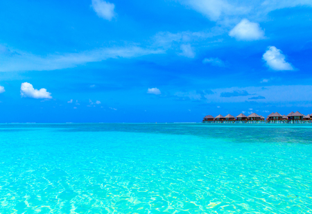 tropical beach in Maldives with few palm trees and blue lagoonのeditorial素材