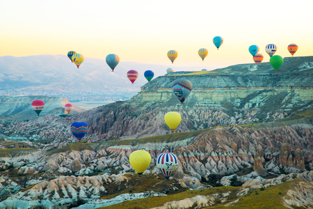 Colorful hot air balloons flying over the valley at Cappadocia, Anatolia, Turkey.のeditorial素材