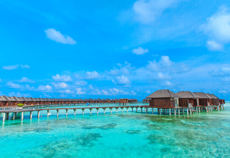 beach with water bungalows at Maldivesの写真素材