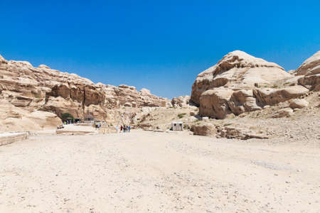 The Siq, the narrow slot-canyon that serves as the entrance passage to the hidden city of Petra,...