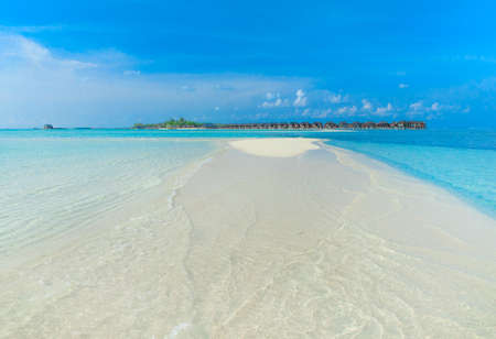 beach with water bungalows at Maldives