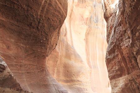 The Siq, the narrow slot-canyon that serves as the entrance passage to the hidden city of Petra, Jordan,の写真素材