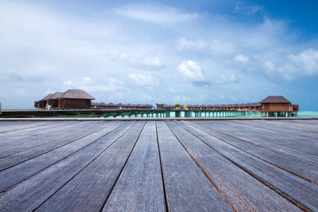 beach with water bungalows at Maldivesの写真素材