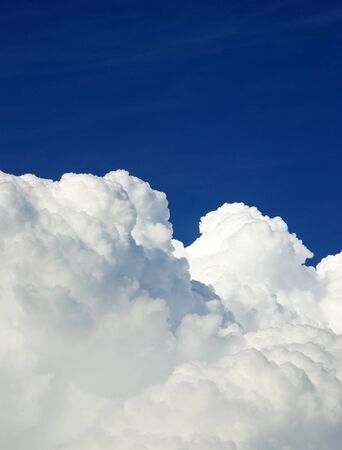Blue sky background with tiny cloudsの写真素材