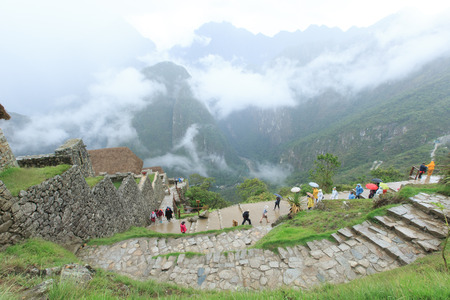 MACHU PICCHU NOVEMBER 11: Tourists walk in Machu Picchu site on November 11 2015 in Machu Picchu.のeditorial素材