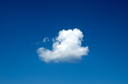 Blue sky background with tiny cloudsの写真素材