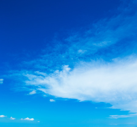 Blue sky background with tiny cloudsの写真素材