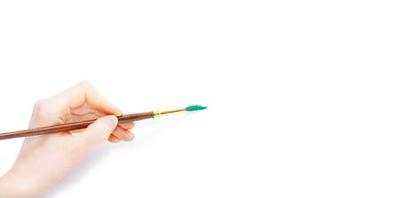 Isolated photo of a brush in a handの写真素材