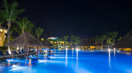 Swimming pool at a luxury Caribbean, tropical resort at nightのeditorial素材