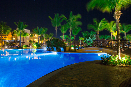 Swimming pool at a luxury Caribbean, tropical resort at nightのeditorial素材