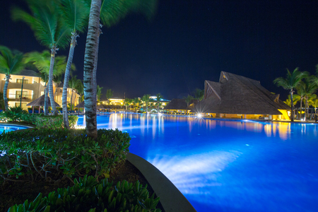 Swimming pool at a luxury Caribbean, tropical resort at nightのeditorial素材