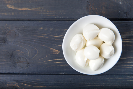 Fresh Mozzarella on wooden background の写真素材