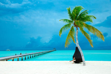 tropical Maldives island with white sandy beach and seaの写真素材