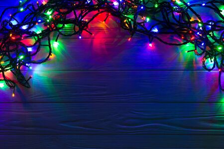 Christmas background with lights and free text space. Christmas lights. Glowing colorful Christmas...