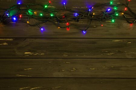 Christmas background with lights and free text space. Christmas lights. Glowing colorful Christmas...