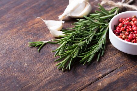 Herbs and spices in ceramic bowls. Aromatic ingredients and natural food additives.の写真素材