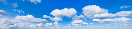 Panoramic fluffy cloud in the blue sky. Sky with cloud on a sunny day.