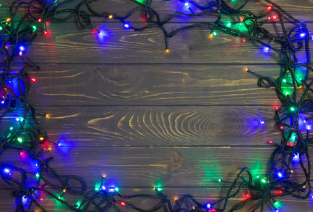 Christmas background with lights and free text space. Christmas lights. Glowing colorful Christmas...