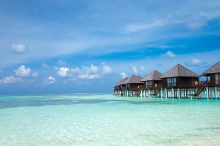 Beautiful tropical Maldives island with beach. Sea with water bungalowsの写真素材