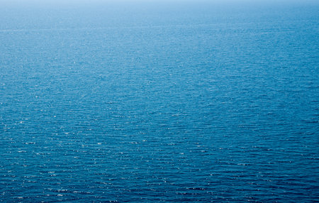 Blue  water with sun reflectionsの写真素材