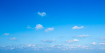 blue sky background with tiny cloudsの写真素材