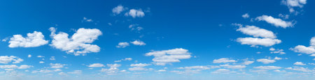 Panoramic fluffy cloud in the blue sky. Sky with cloud on a sunny day.の写真素材