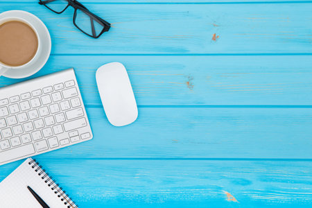 workspace with tablet, keyboard, coffee cup and eyeglasses copy space on background. top view.の写真素材