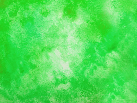 Abstract green watercolor background. The color splashing on the paper. hand drawn.の写真素材