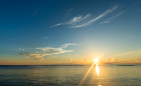 Colorful sunset over ocean on tropical islandの写真素材