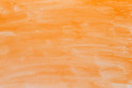 orange watercolor background with space for text or imageの写真素材