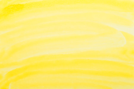 yellow watercolor background. hand painted by brushの写真素材