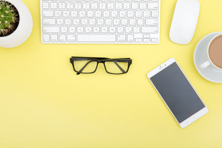 workspace with tablet, keyboard, coffee cup and eyeglasses copy space on background. top view.の写真素材