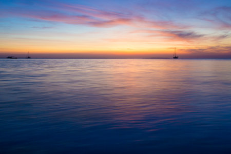 Colorful sunset over ocean on tropical islandの写真素材