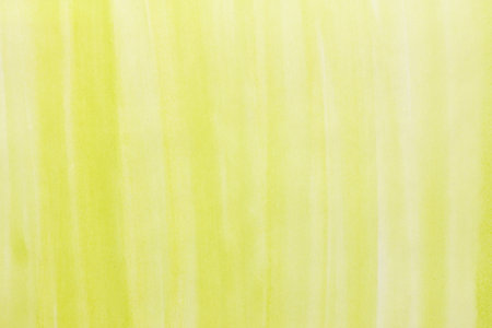 yellow watercolor background. hand painted by brushの写真素材