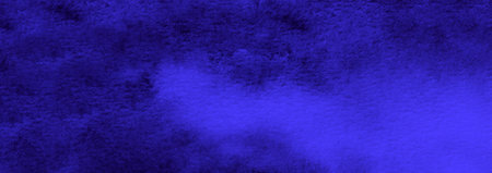 Abstract blue watercolor background. The color splashing on the paper. Hand drawn.の写真素材