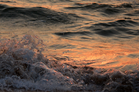 Splashes of the waves at dawnの写真素材