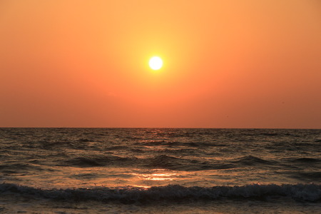 The sun is above the horizon of the seaの写真素材