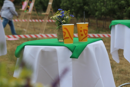 Cups and a vase on the tableの写真素材
