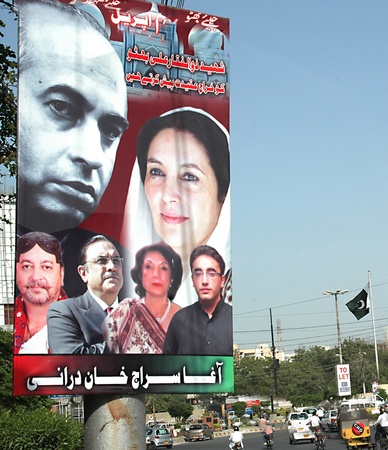 PAKISTAN_KARACHI_ PPP pakistan peoples party political poster with Zulfikar Ali Bhutto,Benazir Bhutoo ,Bilawal Bhutto Zardari  and Nurset Bhutto  Agha Saraj Durani near Jihhan Children Hosptial  9 April 2012  のeditorial素材