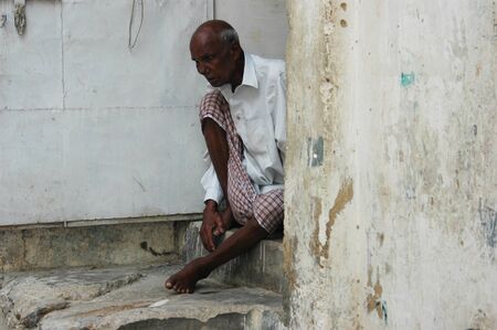 PAKISTAN_KARACHI_  Pakistani christian male senior sist infront of his children home, his children due to take care him in his old age, there arre not senior people care center or home in todays mordern pakistan male sists infront home in Azam Basti  on 1のeditorial素材
