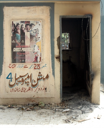 KARACHI/PAKISTAN_ After math Pakistani fire fighter cleaning up Pakistani movies house Prince Cinema house yesterday Pakistani protester burnt down movies during protest Anti Islam film made in USA  in Karachi   22 sEPT. 2012       のeditorial素材